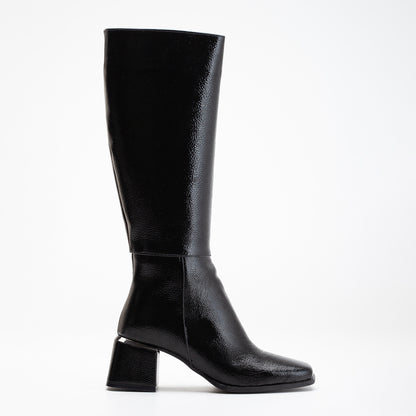 vegan black patent boots, black knee high boots, cruelty-free footwear, eco-friendly fashion, sustainable boots, plant-based patent leather, black vegan boots, non-leather boots, animal-free footwear, ethical fashion, vegan heeled boots, glossy black boots, stylish knee high boots, high heel boots, vegan patent boots, women's vegan footwear