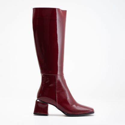 vegan knee high boots, burgundy knee high boots, cruelty-free footwear, eco-friendly fashion, sustainable boots, plant-based leather, burgundy vegan boots, non-leather boots, animal-free footwear, ethical fashion, vegan heeled boots, stylish knee high boots, elegant burgundy boots, high heel boots, vegan leather boots, luxurious vegan boots, women's vegan footwear