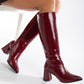 Vegan knee-high boots, black knee-high boots, burgundy knee-high boots, sustainable knee-high boots, cruelty-free knee-high boots, eco-friendly knee-high boots, vegan leather knee-high boots, women's knee-high boots, stylish knee-high boots, faux leather knee-high boots.