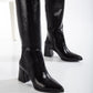 Vegan black knee-high boots, black vegan boots, cruelty-free knee-high boots, sustainable black boots, eco-friendly knee-high boots, vegan leather black boots, women's vegan black boots, stylish black vegan boots, faux leather knee-high boots, black boots for women.