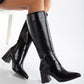 Vegan black knee-high boots, black vegan boots, cruelty-free knee-high boots, sustainable black boots, eco-friendly knee-high boots, vegan leather black boots, women's vegan black boots, stylish black vegan boots, faux leather knee-high boots, black boots for women.