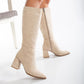 Vegan knee-high boots, beige knee-high boots, sustainable knee-high boots, women's vegan boots, cruelty-free knee-high boots, eco-friendly knee-high boots, vegan leather boots, stylish vegan boots, beige vegan boots, knee-high boots for women.