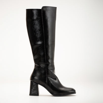 Vegan black knee-high boots, black vegan boots, cruelty-free knee-high boots, sustainable black boots, eco-friendly knee-high boots, vegan leather black boots, women's vegan black boots, stylish black vegan boots, faux leather knee-high boots, black boots for women.