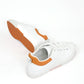 Vegan white and orange sneakers, White and orange vegan athletic shoes, Stylish vegan white and orange trainers, Chic white and orange vegan kicks, Trendy vegan white and orange footwear, Fashionable white and orange vegan sneakers, Elegant vegan white and orange sports shoes, Classic white and orange vegan running shoes, Comfortable vegan white and orange sneakers, White and orange vegan sneakers for casual wear.