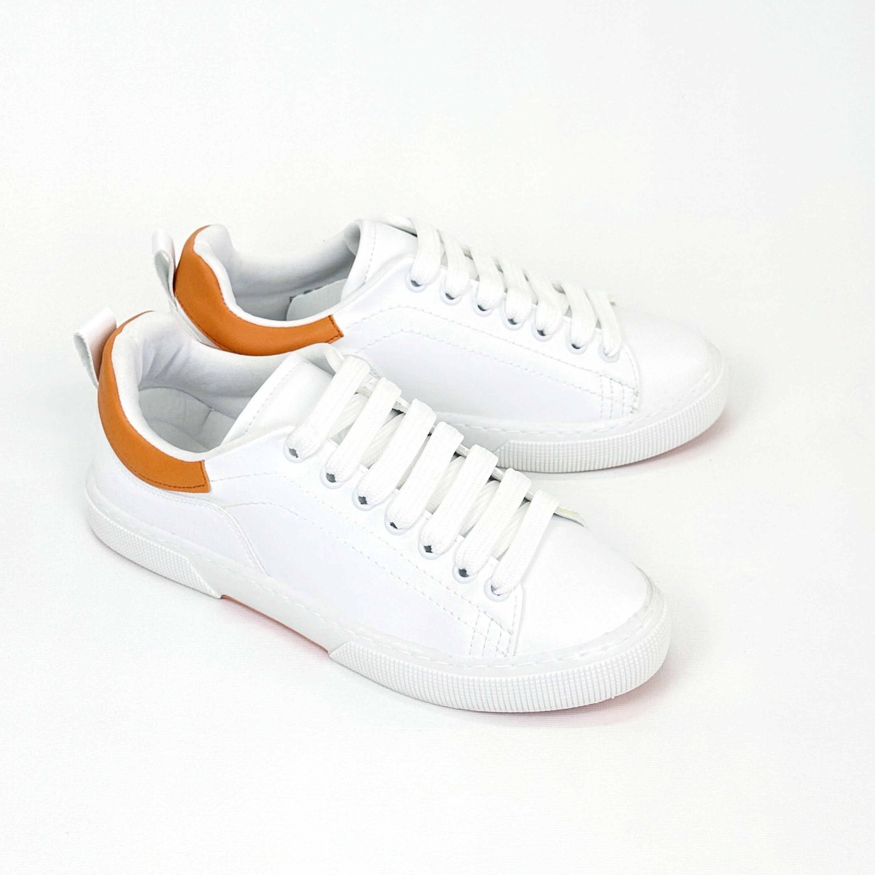 Exploring the Vibrant World of Orange and White Gym Shoes